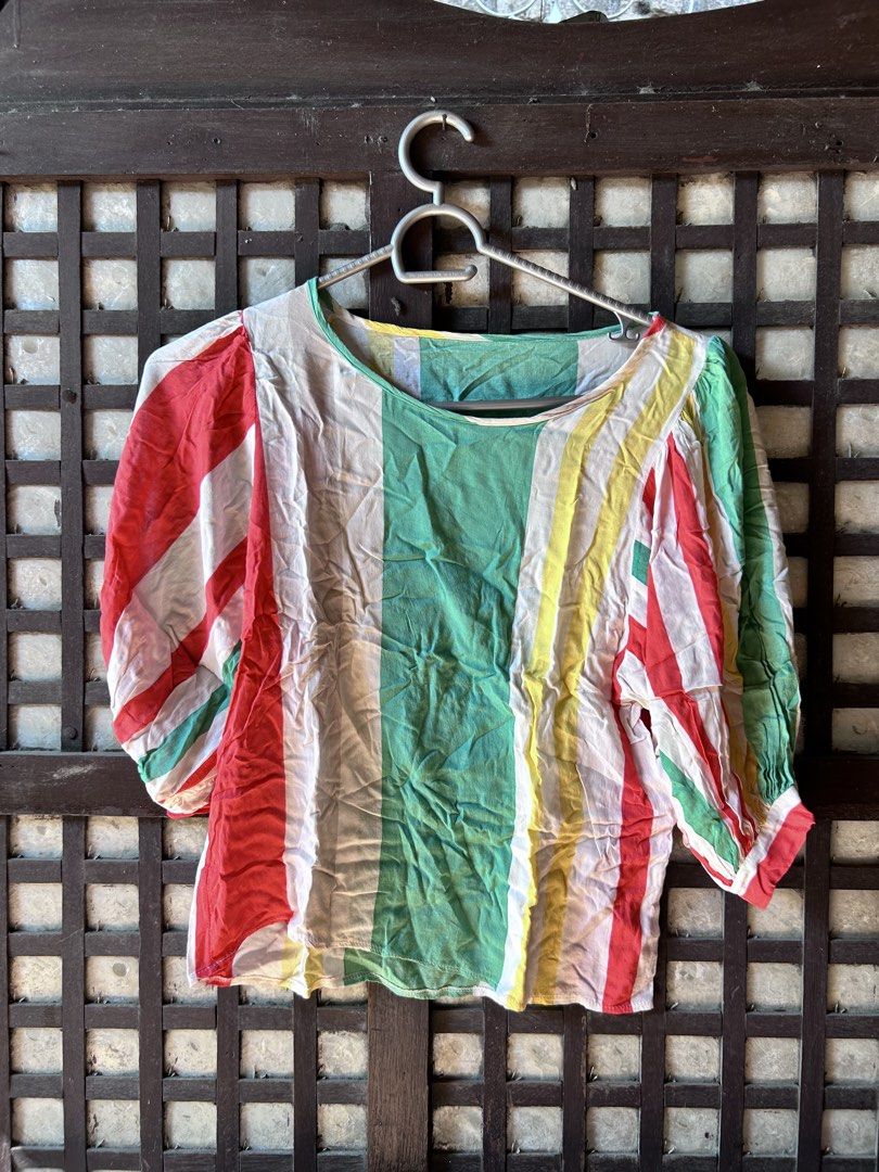 Multicolor Striped Short Sleeve Blouse (Category: Blouses) located in Makati City. Submitted by hzsans92 (Listing ID 1466102778, Image 1). Description: - Vibrant multicolor striped top (green, red, yellow, and white panels) - Trendy short puff sleeves with gathered cuffs - Flattering scoop neckline - Lightweight fabric, ideal for warm weather - Relaxed, comfortable fit - Versatile style that pairs easily with denim jeans or skirts.