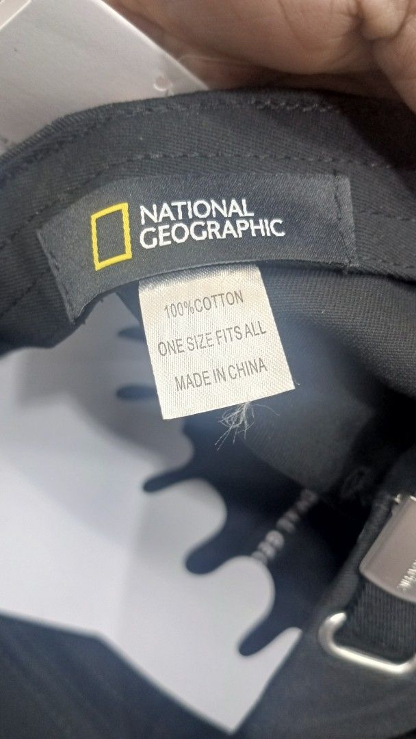 National Geographic Black Baseball Cap Hat (Category: Caps & Hats) located in Alaminos. Submitted by andreid12 (Listing ID 1466105530, Image 2). Description: - Brand: National Geographic - Color: Classic Black - Material: 100% Cotton (One size fits all) - Design: Curved brim with embroidered logo on the front - Details: Adjustable metal buckle strap with engraved logo and branded inner taping - Condition: Brand new / Excellent.
