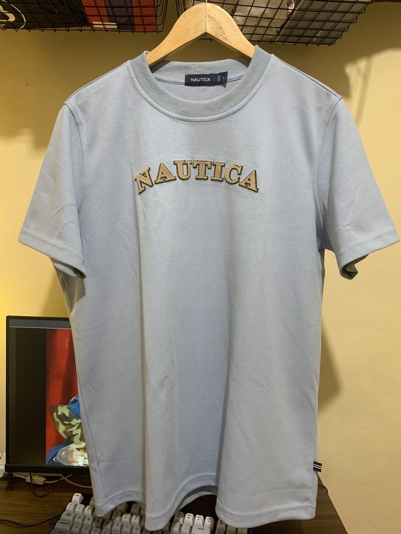Nautica Shirt (Category: Tshirts & Polo Shirts ) located in Manila. Submitted by teyshon6767 (Listing ID 1466082957, Image 2). Description: - Nautica shirt light blue - width 23 -length 29 -SRP 2,999) Bought it 30% off 2,100 Selling Price: ₱1,700 RFS: binili lang dahil sale, Sinukat lang then hindi na nagamit 📍Mandaluyong City.