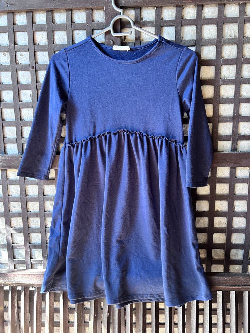 Navy Blue Long Sleeve Ruffled Dress (Category: Dresses) located in Makati City. Submitted by hzsans92 (Listing ID 1466102669, Image 1). Description: Navy blue dress with long sleeves. Round neckline, relaxed fit through the body. Ruffle seam detail right around the waistline creating a flared skirt. Fabric has a smooth cotton-like feel. Clean finish at the cuffs and hem. Great casual piece for everyday wear..
