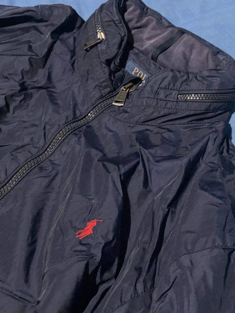 Polo Ralph Lauren Retford Packable Windbreaker Jacket (Category: Coats, Jackets and Outerwear) located in Angeles City. Submitted by rollingwitmary (Listing ID 1466053362, Image 2). Description: • Size: XXL (190/108A) • Color: Navy Blue • Authentic Polo Ralph Lauren • Personal item, not from a reseller • Full-zip design • Lightweight windbreaker, perfect for everyday wear or travel • Classic and timeless Ralph Lauren look Good condition and well 