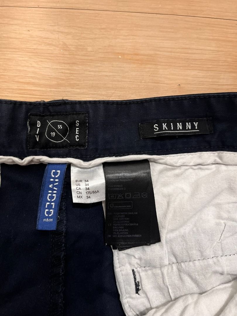 Navy Blue Skinny Casual Pants (Category: Chinos) located in Muntinlupa City. Submitted by keenlion_22f510 (Listing ID 1466025672, Image 2). Description: - Color: Dark blue - Fit: Slim fit through the legs - Closure: Button fly with standard belt loops - Pockets: Front pockets on both sides - Condition: Clean, ready to wear, with minor fading and creases from washing.