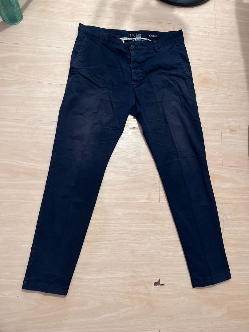 Navy Blue Skinny Casual Pants (Category: Chinos) located in Muntinlupa City. Submitted by keenlion_22f510 (Listing ID 1466025672, Image 1). Description: - Color: Dark blue - Fit: Slim fit through the legs - Closure: Button fly with standard belt loops - Pockets: Front pockets on both sides - Condition: Clean, ready to wear, with minor fading and creases from washing.