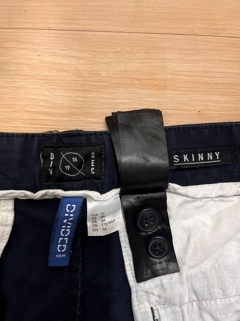 Navy Blue Skinny Casual Pants (Category: Chinos) located in Muntinlupa City. Submitted by keenlion_22f510 (Listing ID 1466025672, Image 3). Description: - Color: Dark blue - Fit: Slim fit through the legs - Closure: Button fly with standard belt loops - Pockets: Front pockets on both sides - Condition: Clean, ready to wear, with minor fading and creases from washing.