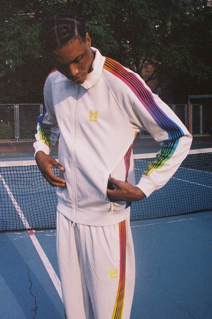 Needles x AWGE Track Jacket Off-White Rainbow (Category: Coats, Jackets and Outerwear) located in Taytay. Submitted by bunsoanglo096 (Listing ID 1466070145, Image 1). Description: W23 L29 cut size tag - Authentic Needles x AWGE collaborative track jacket - Color: Off-white base with colorful rainbow striped taping on sleeves - Features: Full zip closure, high collar, and secure side zip pockets - Branding: Yellow embroidered butterfly logo, AWGE 