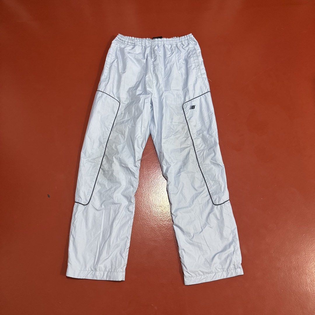 NEW BALANCE NYLON TRACK PANTS (Category: Swim Trunks & Board Shorts) located in Pasig City. Submitted by buzzthrifty (Listing ID 1466111023, Image 2). Description: SIZE 30-36WAIST 38" LENGTH 8"HEM EXCELLENT CONDITION ISSUE KANG SA PULLER GARTER .