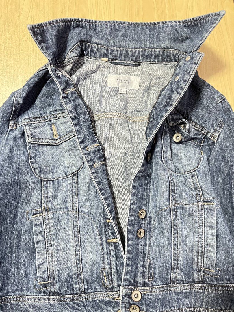 NEXT Denim Jacket (Category: Coats, Jackets and Outerwear) located in Quezon City. Submitted by unoweeko (Listing ID 1466148588, Image 1). Description: Pre-loved NEXT denim jacket. RFS: No longer wearing. No issues. UK: 14, EU: 42 Length: 19” Sleeves: 22.5” Chest: 13” Shoulder: 14” Waist: 17” Has zipper and buttons. Negotiable for SURE buyer..