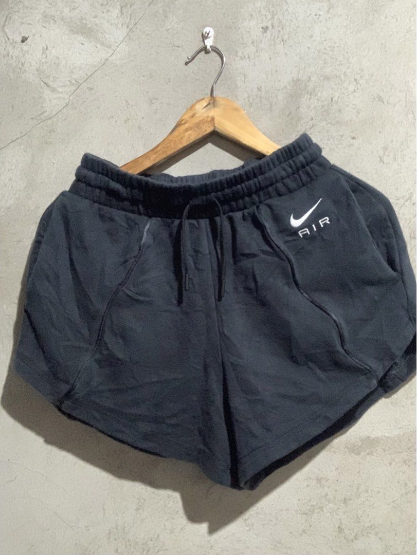 Nike Air Black Athletic Shorts (Category: Shorts) located in Manila. Submitted by jian_thrift (Listing ID 1466046288, Image 1). Description: - Authentic Nike Air shorts in dark grey - Made from soft, cozy fleece fabric ideal for workouts or lounging - Elastic drawstring waist for an adjustable, secure fit - Stylish curved hem with contrast piping along the front - Small Nike Air logo on the left leg - Brand patch centered on the back waistband - 