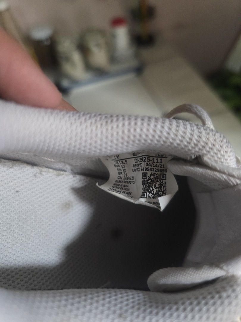 Nike Air Force 1 White (Category: Babies & Kids Fashion) located in Quezon City. Submitted by kbb.12345 (Listing ID 1466001285, Image 3). Description: - Item: White Nike Air Force 1 Sneakers - Size: Youth sizing - Style: Classic low-top with perforated toe box and swoosh branding - Condition: Uppers have creasing and minor scuffs; soles show dirt and tread wear from use - Inclusions: Comes with original laces - Best for: Casual everyday street we