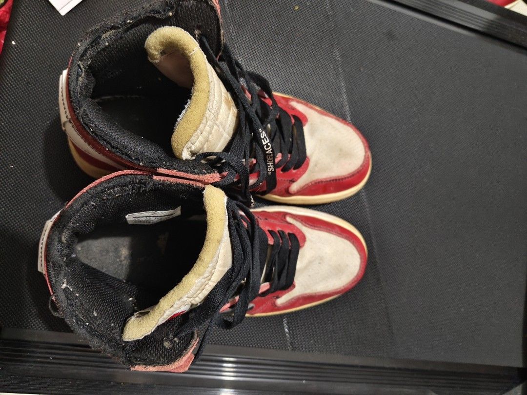 Nike Air Jordan x Off-White (Category: Sneakers) located in Manila. Submitted by vicious1419 (Listing ID 1465975370, Image 3). Description: - Model: Off-White x Nike Air Jordan 1 Retro High 'Chicago' - Design Features: Exposed foam tongues, medial side text prints, 'AIR' branding on midsoles, and signature zip tie - Included: Black laces with 'SHOELACES' text - Condition: Pre-owned with noticeable scuffs, creasing, yellowing on soles, and wear ar
