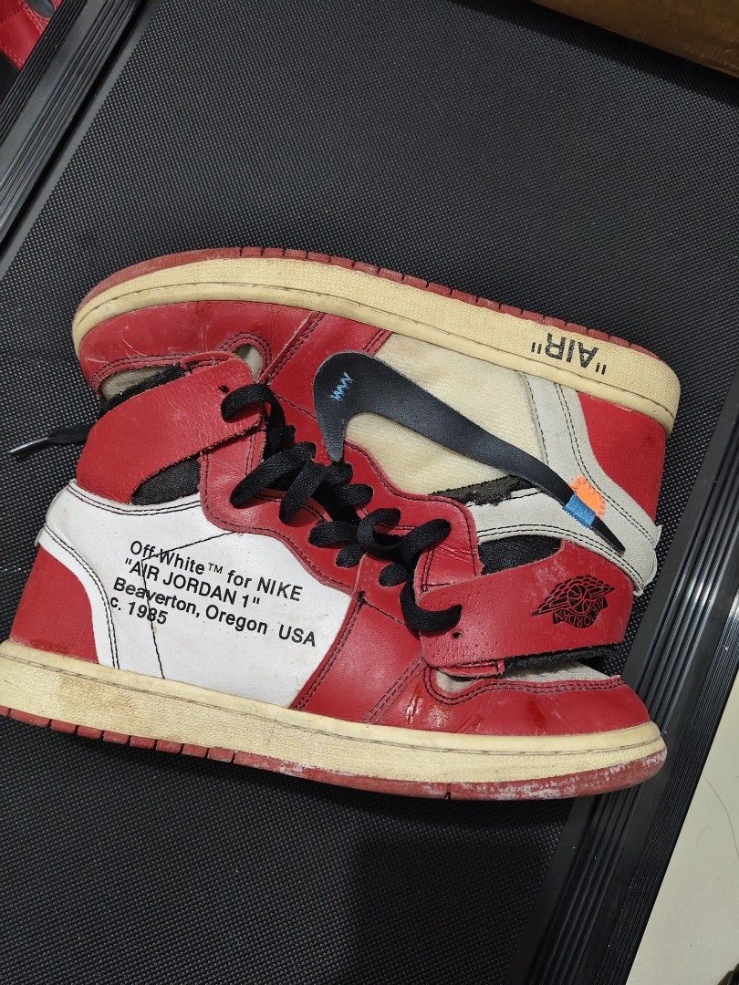 Nike Air Jordan x Off-White (Category: Sneakers) located in Manila. Submitted by vicious1419 (Listing ID 1465975370, Image 1). Description: - Model: Off-White x Nike Air Jordan 1 Retro High 'Chicago' - Design Features: Exposed foam tongues, medial side text prints, 'AIR' branding on midsoles, and signature zip tie - Included: Black laces with 'SHOELACES' text - Condition: Pre-owned with noticeable scuffs, creasing, yellowing on soles, and wear ar