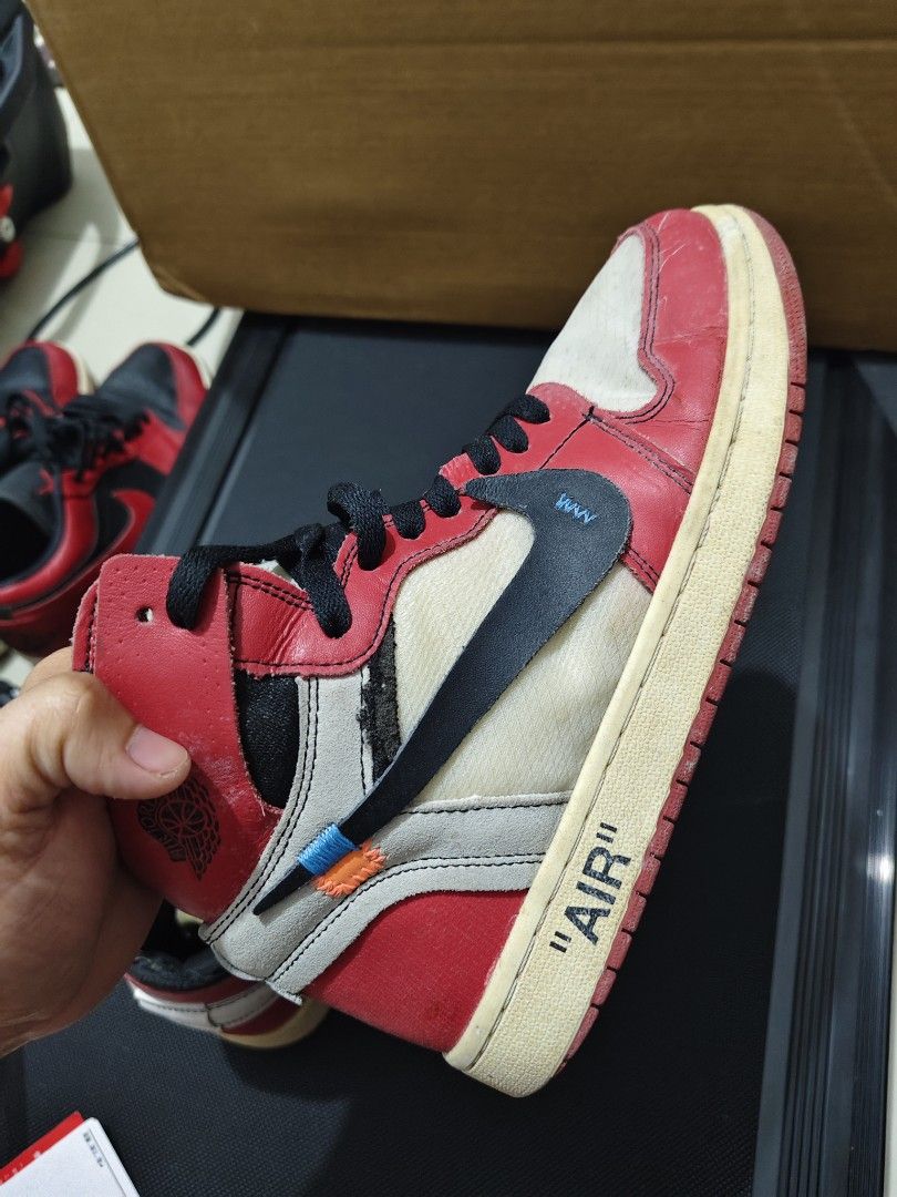 Nike Air Jordan x Off-White (Category: Sneakers) located in Manila. Submitted by vicious1419 (Listing ID 1465975370, Image 2). Description: - Model: Off-White x Nike Air Jordan 1 Retro High 'Chicago' - Design Features: Exposed foam tongues, medial side text prints, 'AIR' branding on midsoles, and signature zip tie - Included: Black laces with 'SHOELACES' text - Condition: Pre-owned with noticeable scuffs, creasing, yellowing on soles, and wear ar