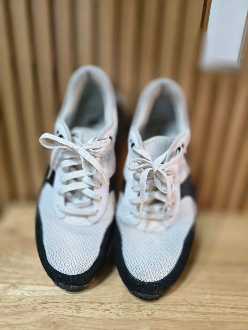 Nike Air Max Black White Sneakers (Category: Sneakers) located in Quezon City. Submitted by allthingsgoode_men (Listing ID 1466107923, Image 2). Description: - Brand/Model: Nike Air Max sneakers - Colorway: Classic Black and White - Material: Mesh and suede upper with white laces - Soles: Chunky soles with decent grip - Condition: Comfortable daily pair with minor dirt on the outsoles from past wear.