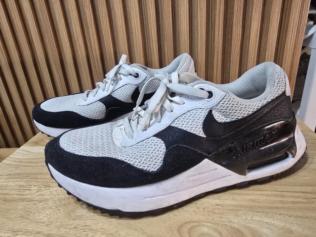 Nike Air Max Black White Sneakers (Category: Sneakers) located in Quezon City. Submitted by allthingsgoode_men (Listing ID 1466107923, Image 1). Description: - Brand/Model: Nike Air Max sneakers - Colorway: Classic Black and White - Material: Mesh and suede upper with white laces - Soles: Chunky soles with decent grip - Condition: Comfortable daily pair with minor dirt on the outsoles from past wear.