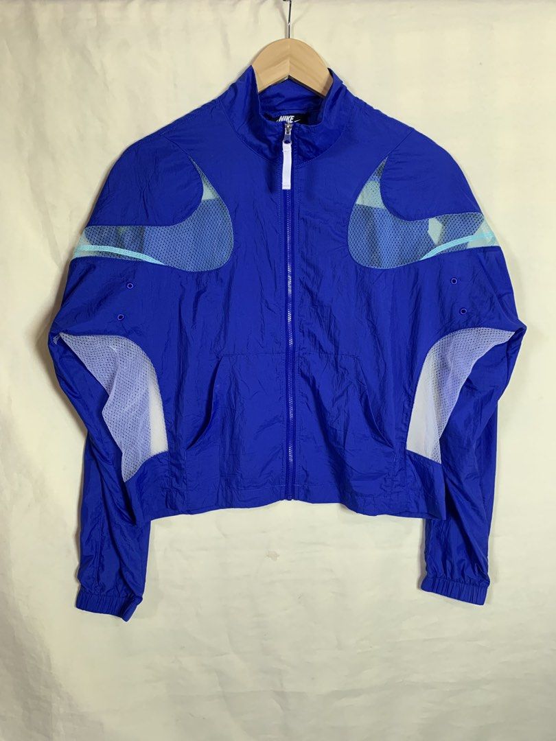 Nike Air Max Blue Mesh Windbreaker Jacket (Category: Coats, Jackets and Outerwear) located in Davao. Submitted by cheineebau09680 (Listing ID 1466099005, Image 1). Description: - Brand: Nike Air Max - Type: Lightweight windbreaker jacket - Color: Bright blue with white mesh panels - Size: L (Made in Vietnam) - Features: Full zip front, high collar, and side pockets - Material: Nylon shell with breathable mesh under arms and back - Condition: Exce