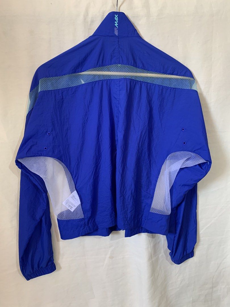 Nike Air Max Blue Mesh Windbreaker Jacket (Category: Coats, Jackets and Outerwear) located in Davao. Submitted by cheineebau09680 (Listing ID 1466099005, Image 2). Description: - Brand: Nike Air Max - Type: Lightweight windbreaker jacket - Color: Bright blue with white mesh panels - Size: L (Made in Vietnam) - Features: Full zip front, high collar, and side pockets - Material: Nylon shell with breathable mesh under arms and back - Condition: Exce