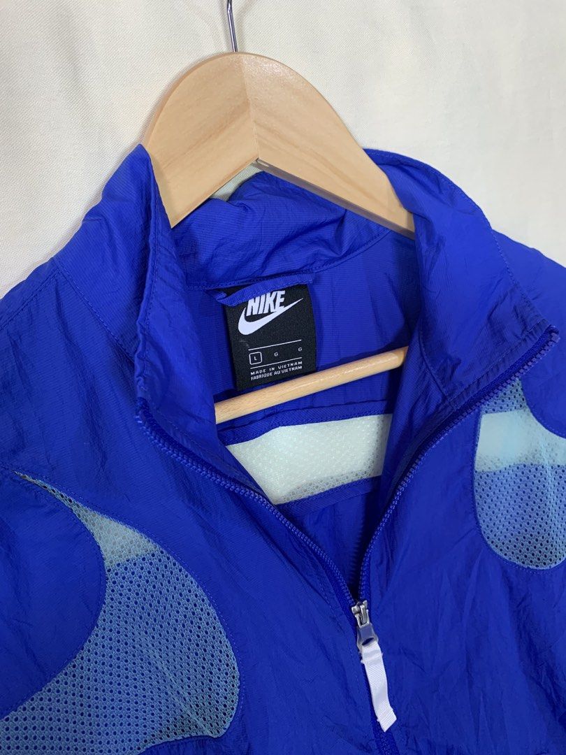 Nike Air Max Blue Mesh Windbreaker Jacket (Category: Coats, Jackets and Outerwear) located in Davao. Submitted by cheineebau09680 (Listing ID 1466099005, Image 3). Description: - Brand: Nike Air Max - Type: Lightweight windbreaker jacket - Color: Bright blue with white mesh panels - Size: L (Made in Vietnam) - Features: Full zip front, high collar, and side pockets - Material: Nylon shell with breathable mesh under arms and back - Condition: Exce