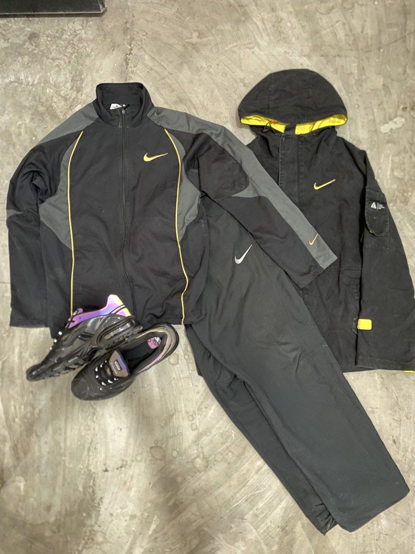 Nike Black and Yellow Tracksuit & ACG Jacket Bundle (Category: Activewear) located in Las Pinas. Submitted by 2fly.margiela (Listing ID 1465958796, Image 3). Description: - Complete Nike Black & Yellow Streetwear Bundle - Full tracksuit set including matching jacket and pants - Extra black hooded jacket featuring striking yellow inner lining - Nike sneakers with unique dark purple iridescent soles - Coordinated black and yellow branding details t