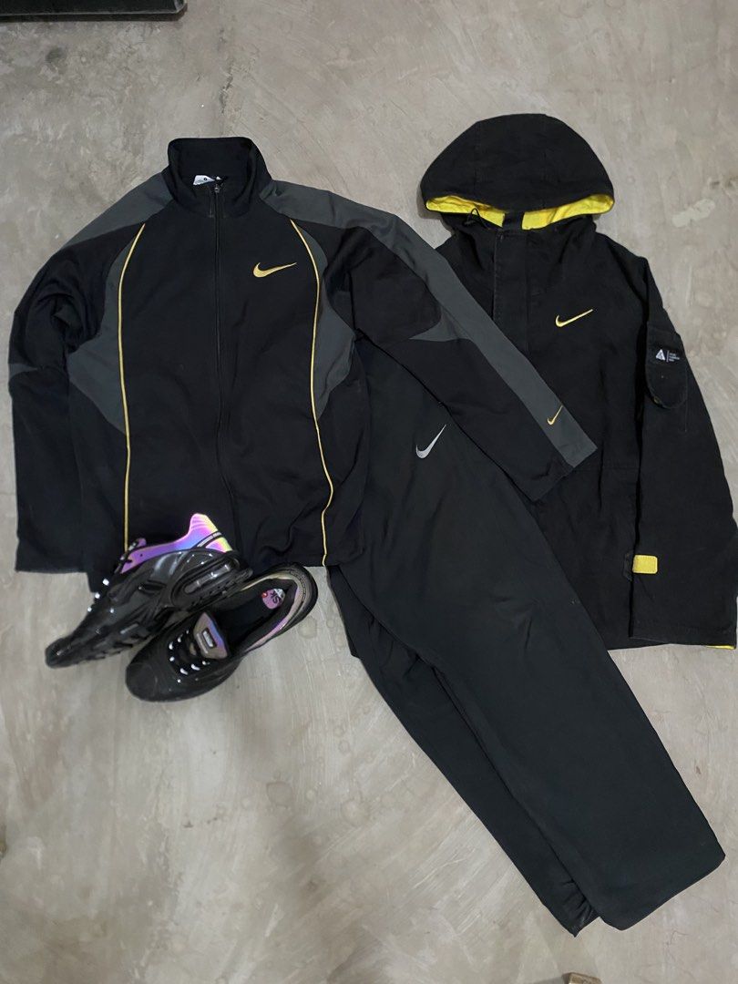 Nike Black and Yellow Tracksuit & ACG Jacket Bundle (Category: Activewear) located in Las Pinas. Submitted by 2fly.margiela (Listing ID 1465958796, Image 2). Description: - Complete Nike Black & Yellow Streetwear Bundle - Full tracksuit set including matching jacket and pants - Extra black hooded jacket featuring striking yellow inner lining - Nike sneakers with unique dark purple iridescent soles - Coordinated black and yellow branding details t