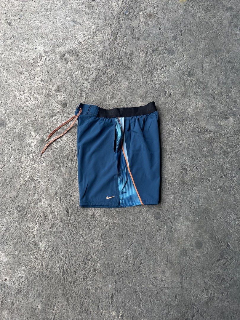 Nike Blue Athletic Shorts with Orange Drawstring (Category: Shorts) located in Polangui. Submitted by b0ssl00ts (Listing ID 1465962655, Image 1). Description: - Brand: Nike - Color: Blue with light blue side panels and orange accents - Features: Black elastic waistband, adjustable orange drawstring, small orange Nike swoosh logo - Condition: Brand new / Excellent (ready to wear) - Best for: Gym workouts, running, sports, and casual athleisure .
