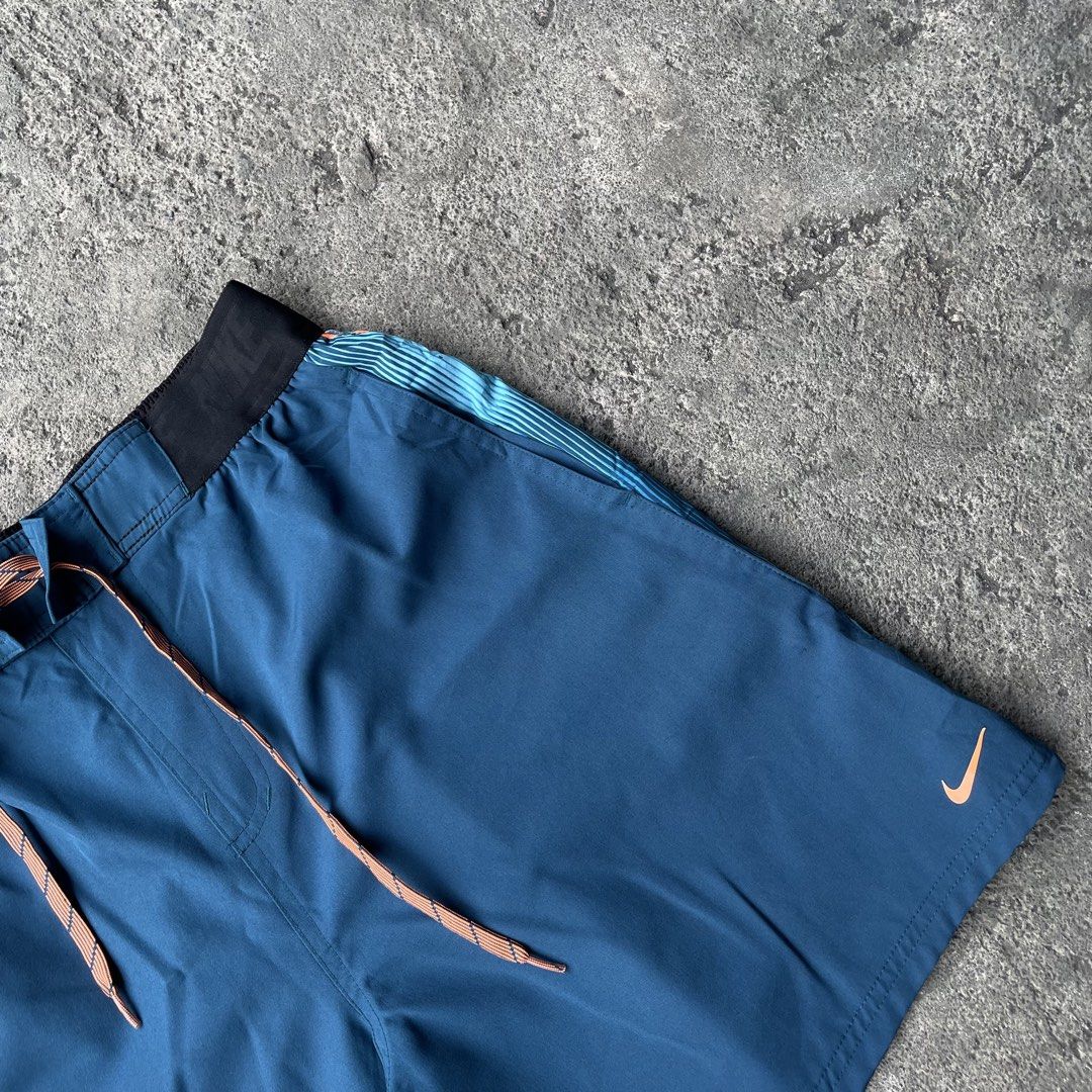 Nike Blue Athletic Shorts with Orange Drawstring (Category: Shorts) located in Polangui. Submitted by b0ssl00ts (Listing ID 1465962655, Image 3). Description: - Brand: Nike - Color: Blue with light blue side panels and orange accents - Features: Black elastic waistband, adjustable orange drawstring, small orange Nike swoosh logo - Condition: Brand new / Excellent (ready to wear) - Best for: Gym workouts, running, sports, and casual athleisure .