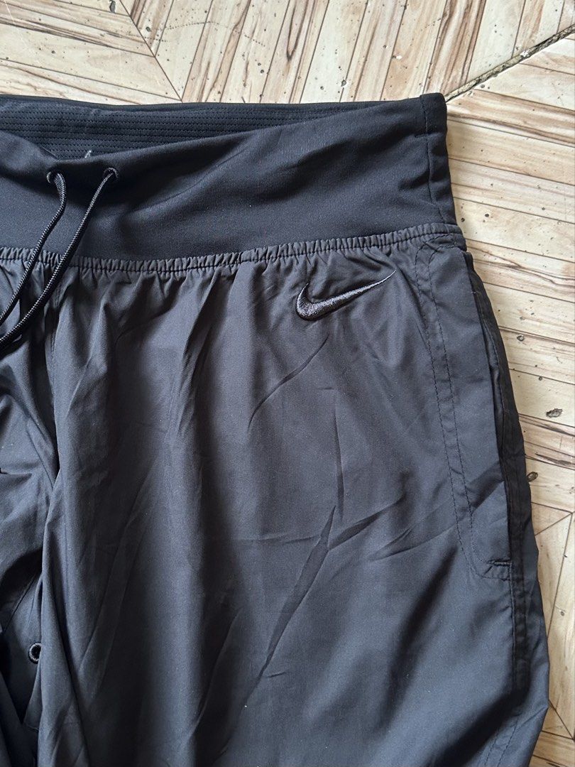 Nike Dri-Fit Black Cropped Jogger Pants Size S (Category: Joggers) located in Angeles City. Submitted by alejeong27 (Listing ID 1466028126, Image 3). Description: - Brand/Model: Nike Dri-Fit Black Cropped Pants - Size: S (Waist: 65 cm, Best for Height: 150-160 cm) - Material: 100% Polyester with breathable mesh inner lining - Fit & Features: Elastic waistband with adjustable drawstring, trendy cuffed hems - Storage: Convenient back zippered pocke