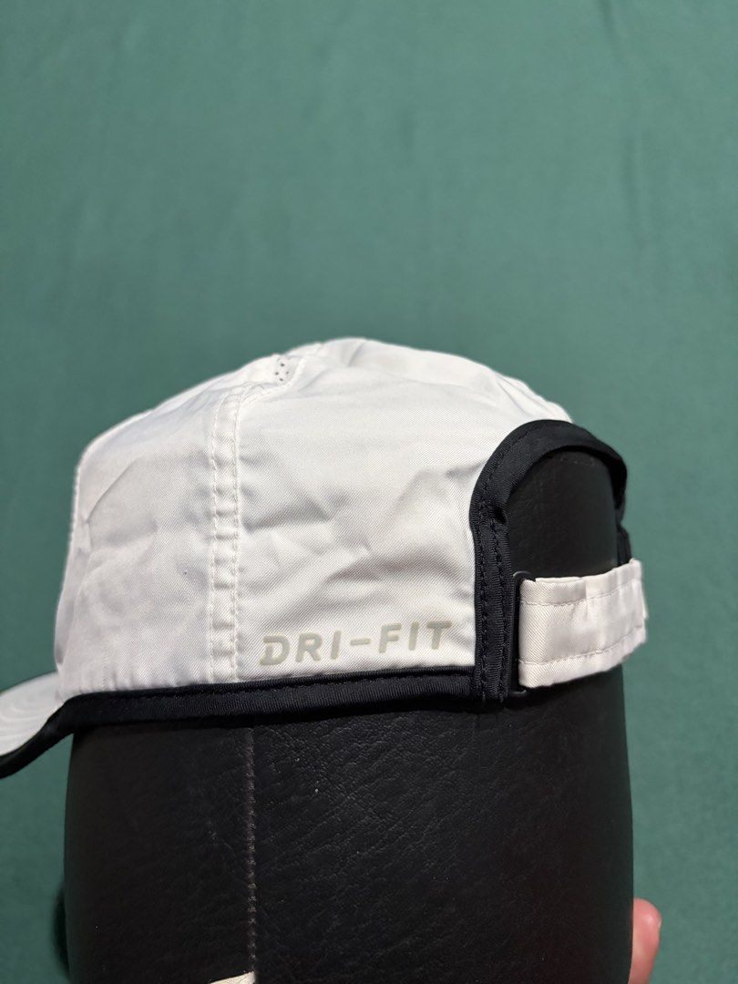 Nike Dri-FIT Featherlight White Black Running Cap (Category: Caps & Hats) located in Guihulngan. Submitted by fbthriftgoodsniace (Listing ID 1466013692, Image 3). Description: - Authentic Nike Dri-FIT running cap (White & Black) - Lightweight and breathable with perforated panels for ventilation - Iconic embroidered black Swoosh on the front - Adjustable velcro back strap with small Swoosh tab - Dri-FIT technology print on the side - Clean interi