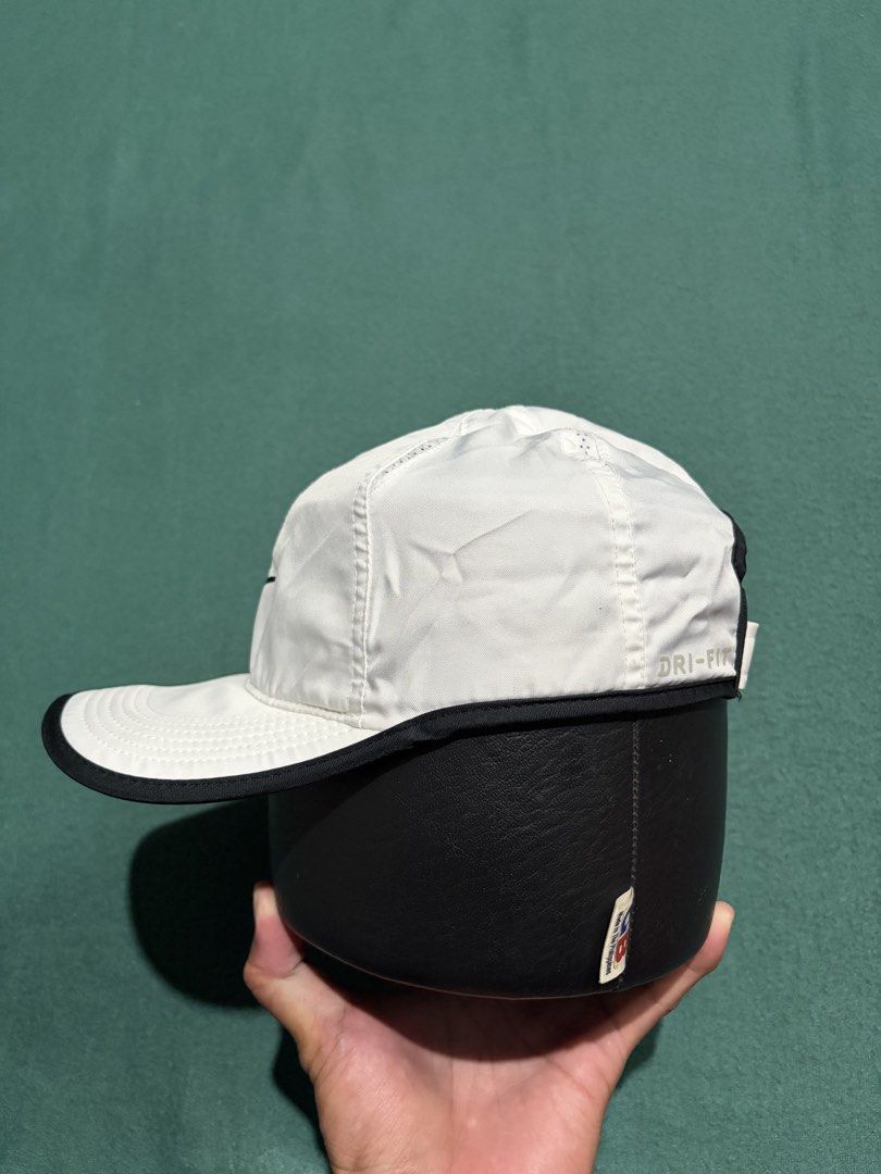 Nike Dri-FIT Featherlight White Black Running Cap (Category: Caps & Hats) located in Guihulngan. Submitted by fbthriftgoodsniace (Listing ID 1466013692, Image 2). Description: - Authentic Nike Dri-FIT running cap (White & Black) - Lightweight and breathable with perforated panels for ventilation - Iconic embroidered black Swoosh on the front - Adjustable velcro back strap with small Swoosh tab - Dri-FIT technology print on the side - Clean interi