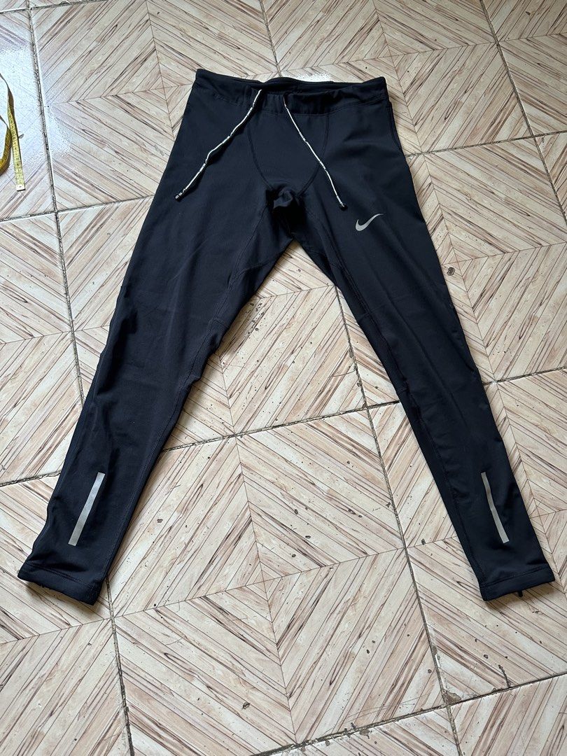 Nike Dri-FIT Men's Running Tights Black Size M (Category: Activewear) located in Angeles City. Submitted by alejeong27 (Listing ID 1466028021, Image 1). Description: - Brand: Nike - Item: Running Tights / Leggings - Color: Black - Size: Medium (M) - Condition: Excellent / Like New - Dri-FIT material wicks sweat to keep you dry - Adjustable drawstring waistband for a custom fit - Secure zippered pocket at the back waist for essentials - Mesh panel