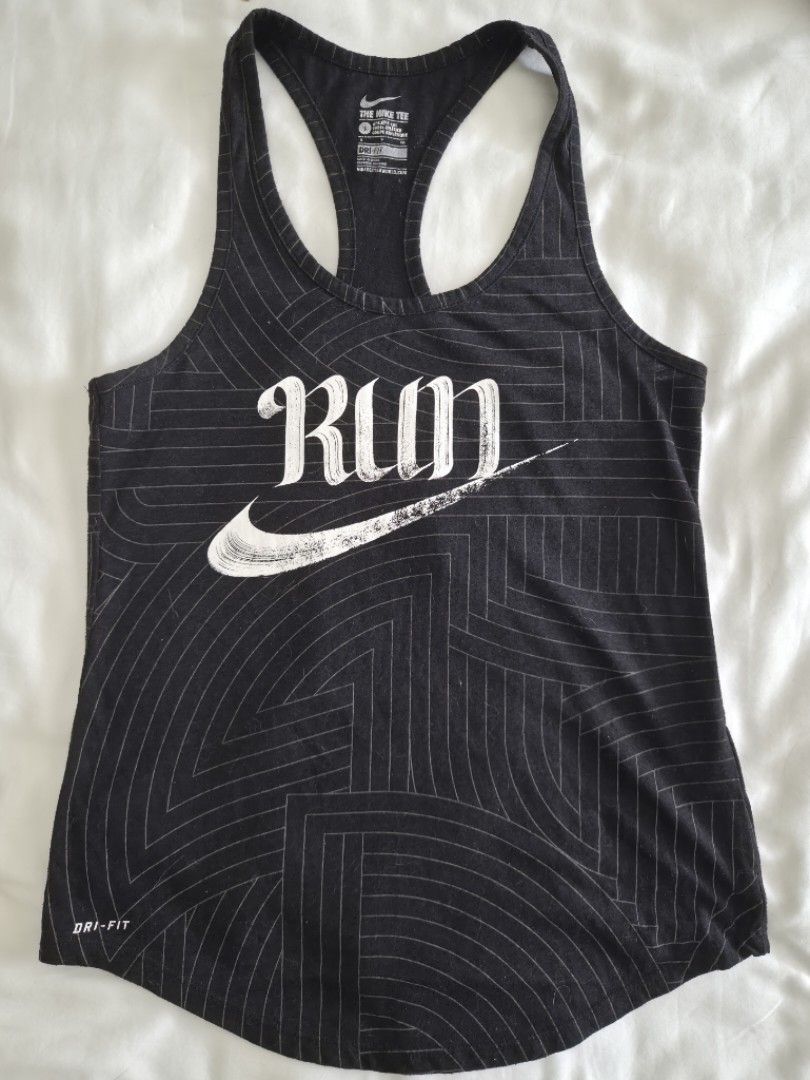 Nike Dri-FIT Run Graphic Tank Top (Category: Activewear) located in Quezon City. Submitted by corrnic (Listing ID 1465997834, Image 2). Description: - Brand: Nike - Style: Dri-FIT Racerback Tank Top - Size: S - Color: Black with geometric graphic lines - Details: Large white 'Run' logo on front, small Swoosh logo on the back - Material: Lightweight athletic fabric - Condition: Excellent / Great for gym workouts and running.