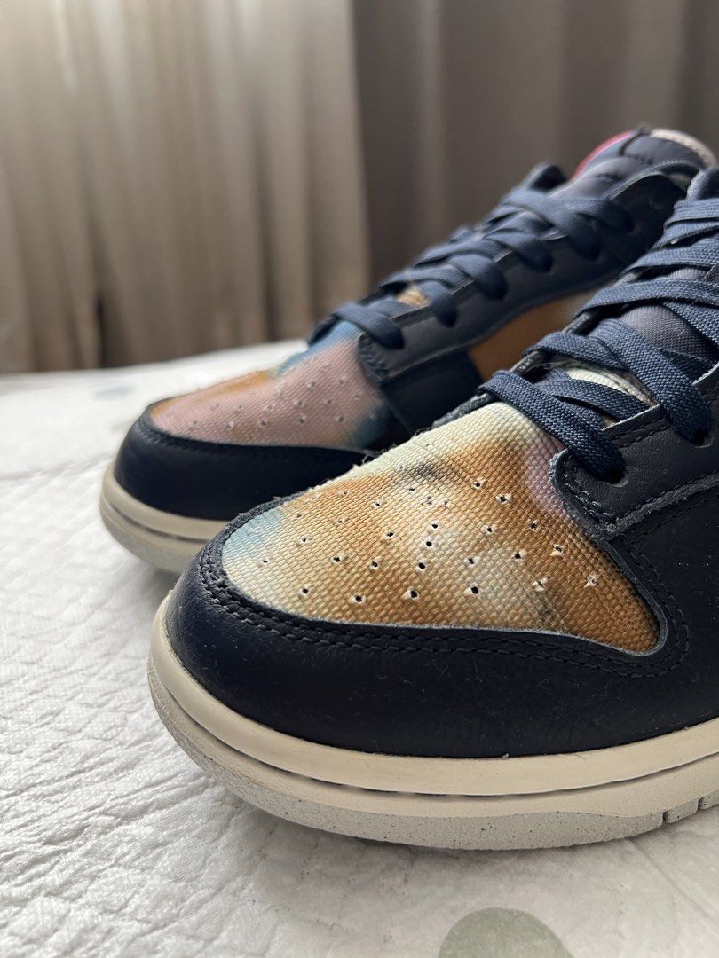 NIKE Dunk Low SE ‘Graffiti - Obsidian’ Size 10 (Category: Sneakers) located in Pasig City. Submitted by jenscloset86 (Listing ID 1465998509, Image 3). Description: Brand: NIKE Model: Nike Dunk Low SE ‘Graffiti - Obsidian’ Size: US 10 • No flaws, no damages. • Lightly used. • With box. - Nike Dunk Low sneakers - Unique tie-dye pattern on toe box and heel - Navy blue leather overlays - Classic Nike branding - Lace-up closure - Ideal for casual wear