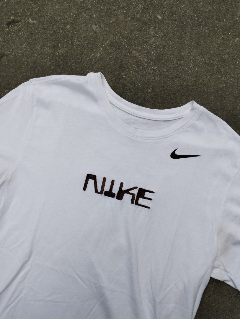 Nike Embroided Big Swoosh on back Tee (Category: Tshirts & Polo Shirts ) located in Manila. Submitted by neil_sellingaccount (Listing ID 1466081573, Image 2). Description: 22 width 29 length 9/10 color rate good condition no issue.