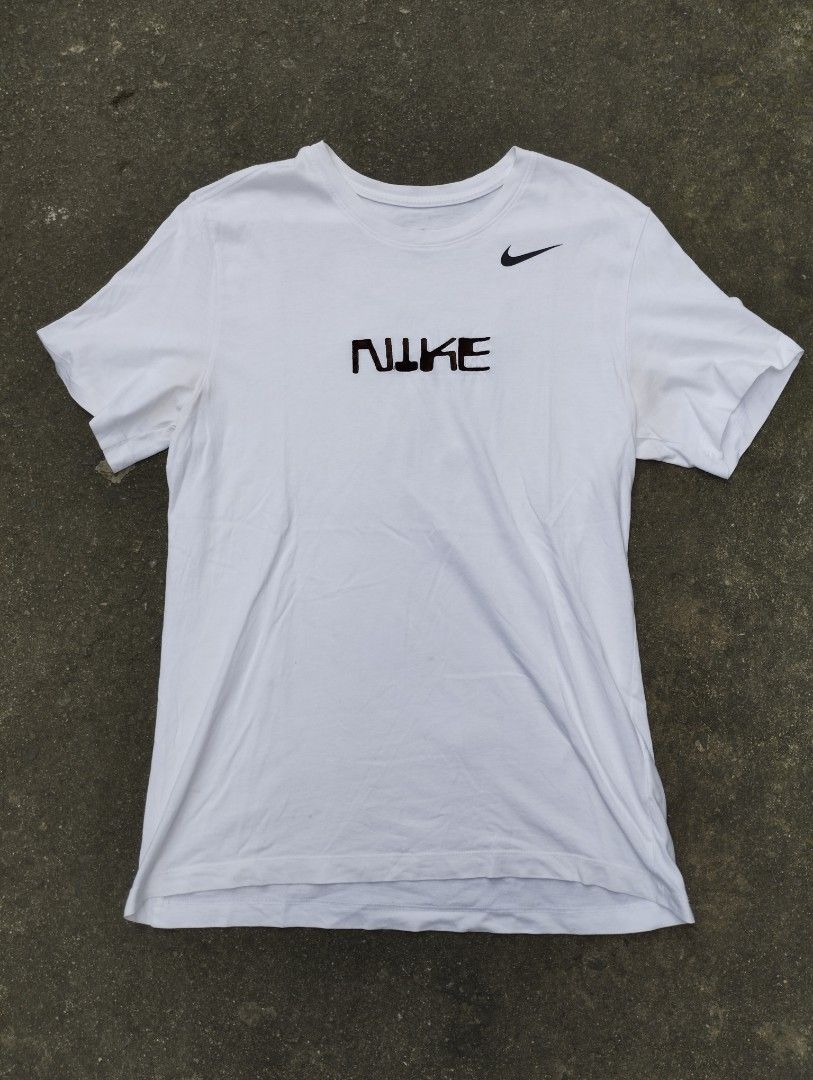 Nike Embroided Big Swoosh on back Tee (Category: Tshirts & Polo Shirts ) located in Manila. Submitted by neil_sellingaccount (Listing ID 1466081573, Image 1). Description: 22 width 29 length 9/10 color rate good condition no issue.