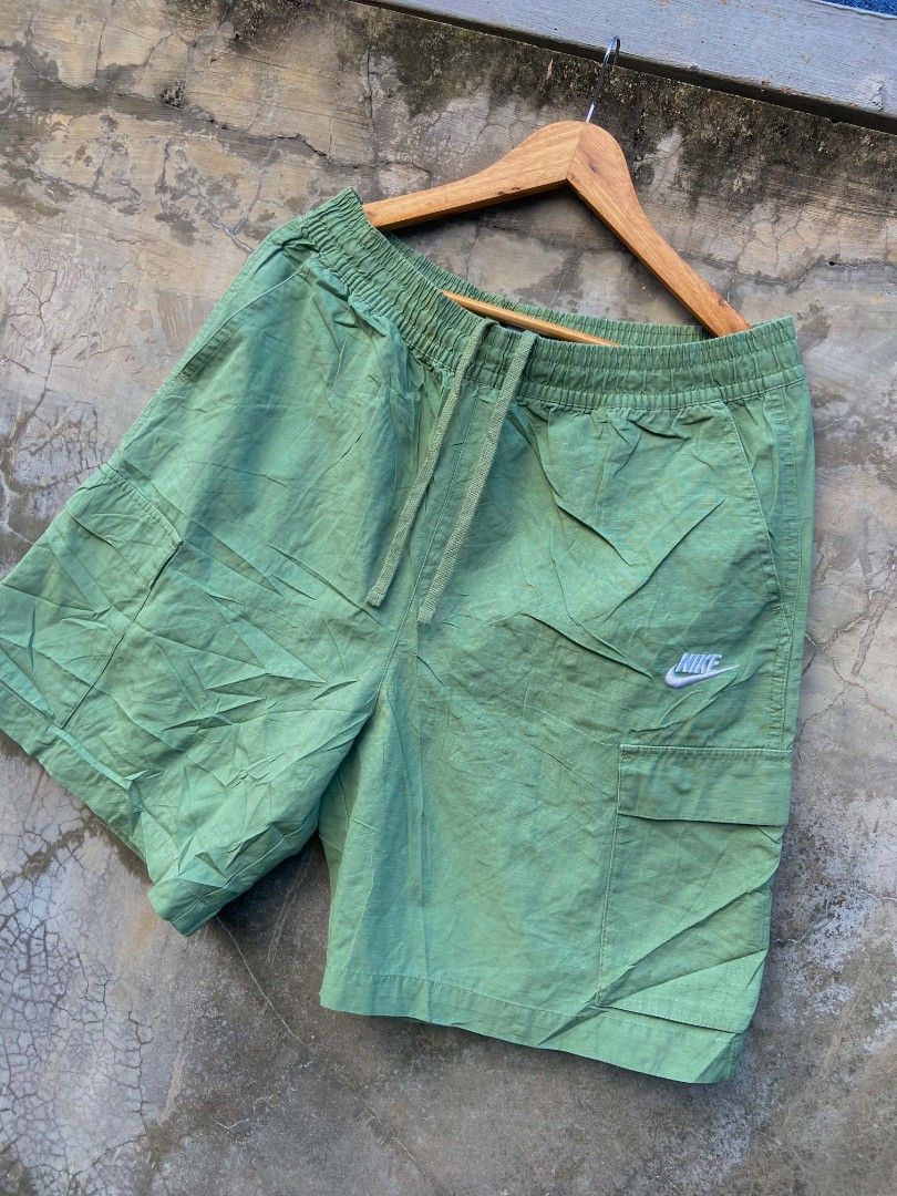 Nike Green Cargo Shorts XL (Category: Shorts) located in Davao. Submitted by drayliii (Listing ID 1466063762, Image 3). Description: NYKE CLUB CARGO (RIPSTOP FABRIC) Size 30-34 XL tag Excellent (TUNAY NA KULAY GOOGLE PIC) 780+ship Davao city - Brand: Nike - Color: Green - Size: XL - Material: 100% cotton (Made in China) - Waistband: Elastic with adjustable drawstring - Pockets: 2 side pockets, 2 leg cargo pockets, and 1 rear button-closure pocket