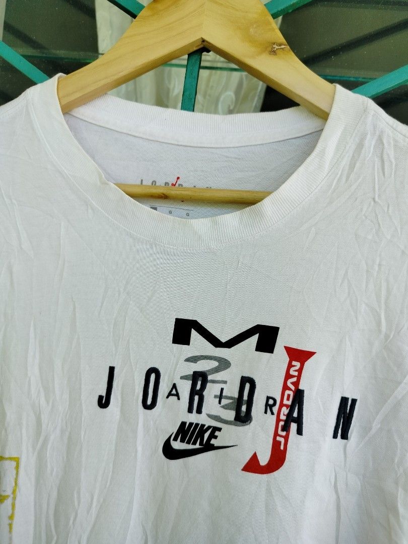Nike Jordan Graphic Tee White Size L (Category: Tshirts & Polo Shirts ) located in Manila. Submitted by geraldquinto_917 (Listing ID 1465965120, Image 3). Description: - Brand: Nike Jordan - Size: Large - Color: White - Material: 100% Cotton - Design: Multicolor collage graphic with MJ and basketball imagery on front and lower side - Details: Short sleeves, classic crew neck, style code CJ6224-100 - Condition: Brand new / Excellent quality - Ship