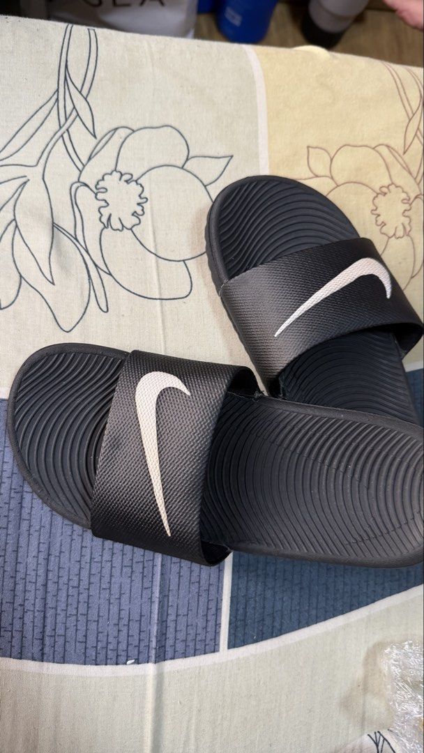 Nike Kawa Slides Black/White Size 2Y (Category: Kids Wardrobes & Storage) located in Pasay City. Submitted by yssavibe14 (Listing ID 1466120478, Image 2). Description: - Brand: Nike - Model: Kawa Slides Bought for 1,600 Now selling for only 1000 - Colorway: Black/White - Style Code: 819352-001 - Size: 2Y (Kids) - Contoured footbed and textured strap for comfort - Lightweight and flexible slip-on design - Ideal for casual, daily wear.