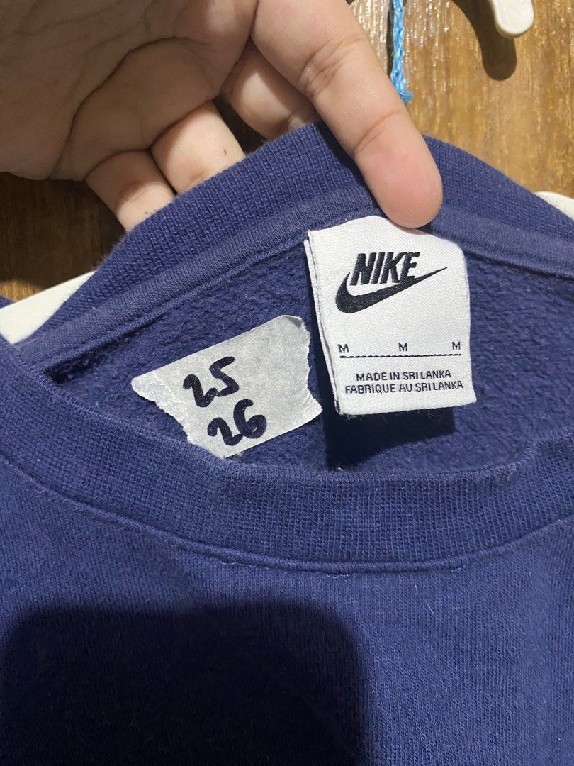 Nike Navy Blue Crewneck Sweatshirt (Category: Coats, Jackets and Outerwear) located in Imus. Submitted by frootiloots4103 (Listing ID 1466002261, Image 3). Description: - Brand: Nike - Color: Dark Blue - Size: Medium (Tag inside) 25x26 - Origin: Made in Sri Lanka - Design: Classic embroidered chest logo, solid color - Fit: Comfortable classic fit for casual wear - Details: Long sleeves, ribbed cuffs and hem - Condition: Clean and well-maintained 