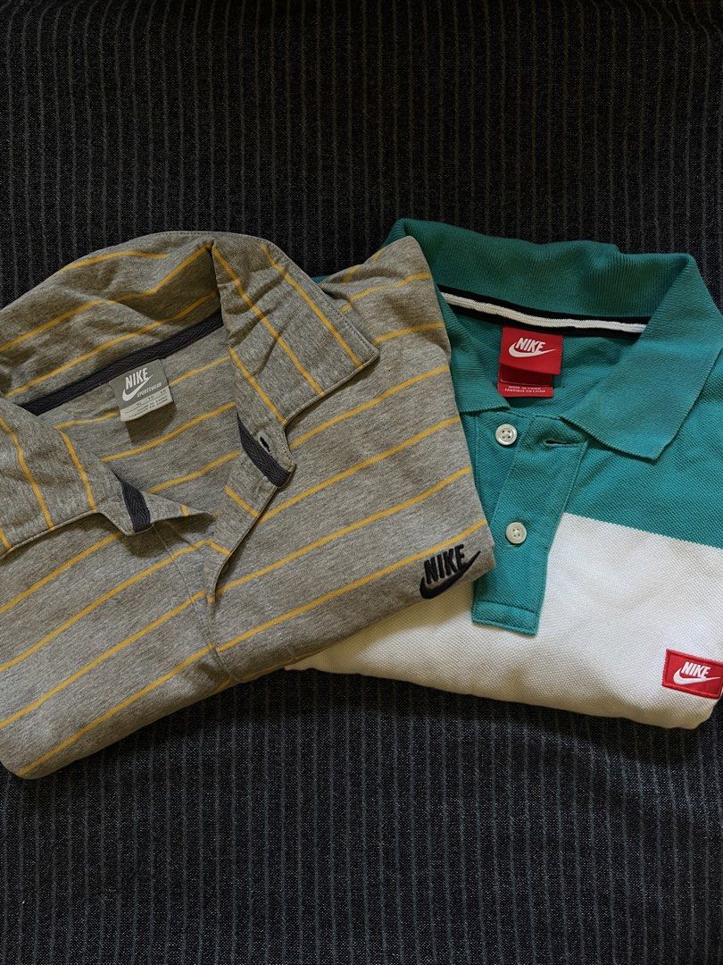 Nike Polo Shirts Bundle Size XL (Category: Tshirts & Polo Shirts ) located in Manila. Submitted by gelinem_13 (Listing ID 1466045850, Image 1). Description: - Bundle of 2 authentic Nike polo shirts - Size: XL for both shirts - Shirt 1: Grey with yellow horizontal stripes and embroidered black logo - Shirt 2: Teal and white color-block design with red label details - Material: Comfortable and breathable cotton pique - Design: Classic collar with b
