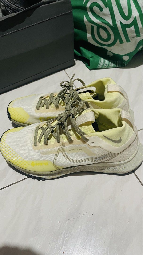 Nike React Pegasus Trail 4 Gore-Tex Yellow Trail Shoes (Category: Sneakers) located in Quezon City. Submitted by i2ochelle227661 (Listing ID 1465989087, Image 1). Description: - Original and bought from USA - Model: Nike React Pegasus Trail 4 Gore-Tex - Colorway: Yellow and white with olive green laces - Waterproof GORE-TEX membrane to keep your feet dry in wet conditions - Cushioned midsole for superior comfort on long-distance runs - Durable ru