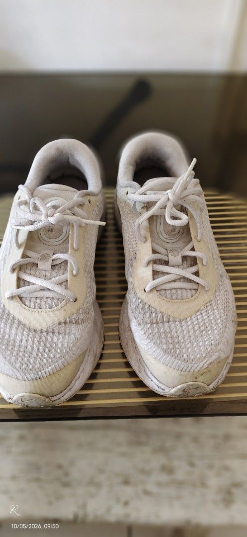 Nike Running Shoes White Silver (Category: Sneakers) located in Las Pinas. Submitted by Kariicature (Listing ID 1465965745, Image 1). Description: NEGOTIABLE - Brand: Nike running shoes - Color: White and silver with metallic midsole details - Material: Breathable mesh upper with lace-up fastening - Features: Small swoosh logo at the heel and printed branding on the interior sole - Condition: Signs of wear and yellowing on the fabric and soles na