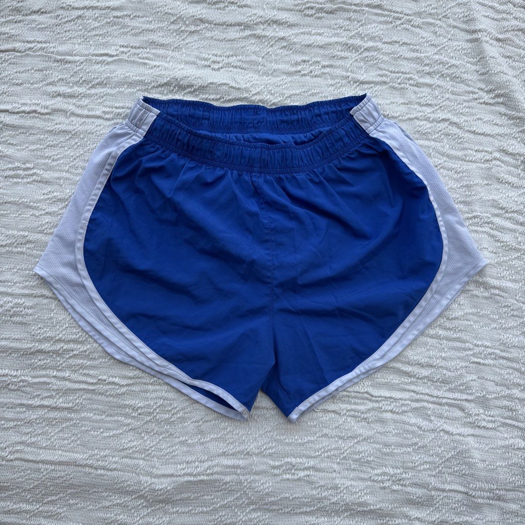 Nike Running Shorts Blue & White (Category: Activewear) located in Manila. Submitted by thriftclub.ph (Listing ID 1466090064, Image 1). Description: ▫️Decluttering (too many sportswear!) ◻️ Medium on tag ⬜️ Has drawstring & inner panty ⚪️ Flaw: Check logo got removed .