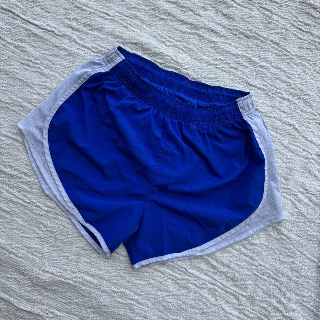 Nike Running Shorts Blue & White (Category: Activewear) located in Manila. Submitted by thriftclub.ph (Listing ID 1466090064, Image 2). Description: ▫️Decluttering (too many sportswear!) ◻️ Medium on tag ⬜️ Has drawstring & inner panty ⚪️ Flaw: Check logo got removed .