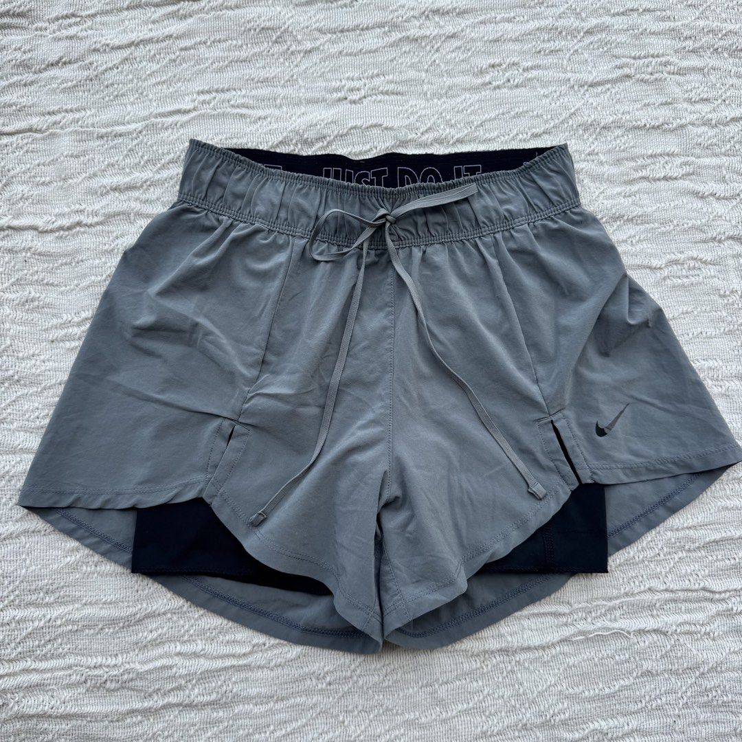 Nike Running Shorts Gray Flex Essential (Category: Activewear) located in Manila. Submitted by thriftclub.ph (Listing ID 1466097105, Image 1). Description: ▫️Decluttering (too many sportswear!) ◻️ Fits xs - s ⬜️ Has drawstring + 1 side pocket (cycling) ⚪️ Flaw: Portion of logo got removed ⬜️ In good condition ◻️ Perfect for running ▫️With “Just Do It” written in garter.