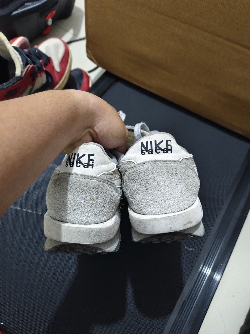 Nike Sacai Fragment Grey (Category: Sneakers) located in Manila. Submitted by vicious1419 (Listing ID 1465975976, Image 3). Description: EURO 42.5 - Model: Nike LDWaffle x sacai x Fragment - Colorway: Grey and White - Design Details: Double-stacked swooshes, Fragment midsole text, waffle outsole, dual branding tongue tags - Materials: Premium suede overlays with breathable mesh base - Condition: Shows dirt and wear on outsoles and midsoles from p