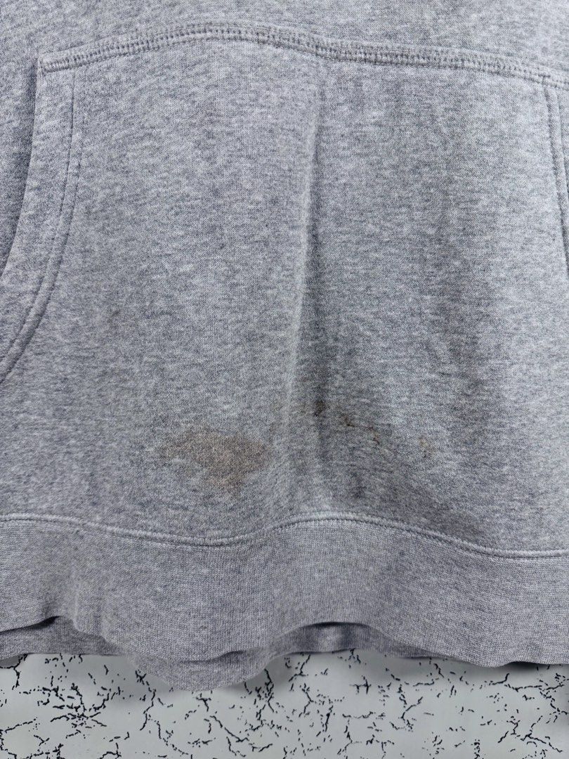 Nike SB Heather Grey Pullover Hoodie Size XL (Category: Hoodies) located in Roxas City. Submitted by patsquarephantz (Listing ID 1466088604, Image 3). Description: - Brand: Nike SB - Style: Pullover Hoodie - Color: Classic Heather Grey - Size: XL - Details: Black Nike SB logo on chest, adjustable drawstring hood, front kangaroo pocket - Condition: Noticeable discoloration and stains near the bottom pocket area (priced accordingly).