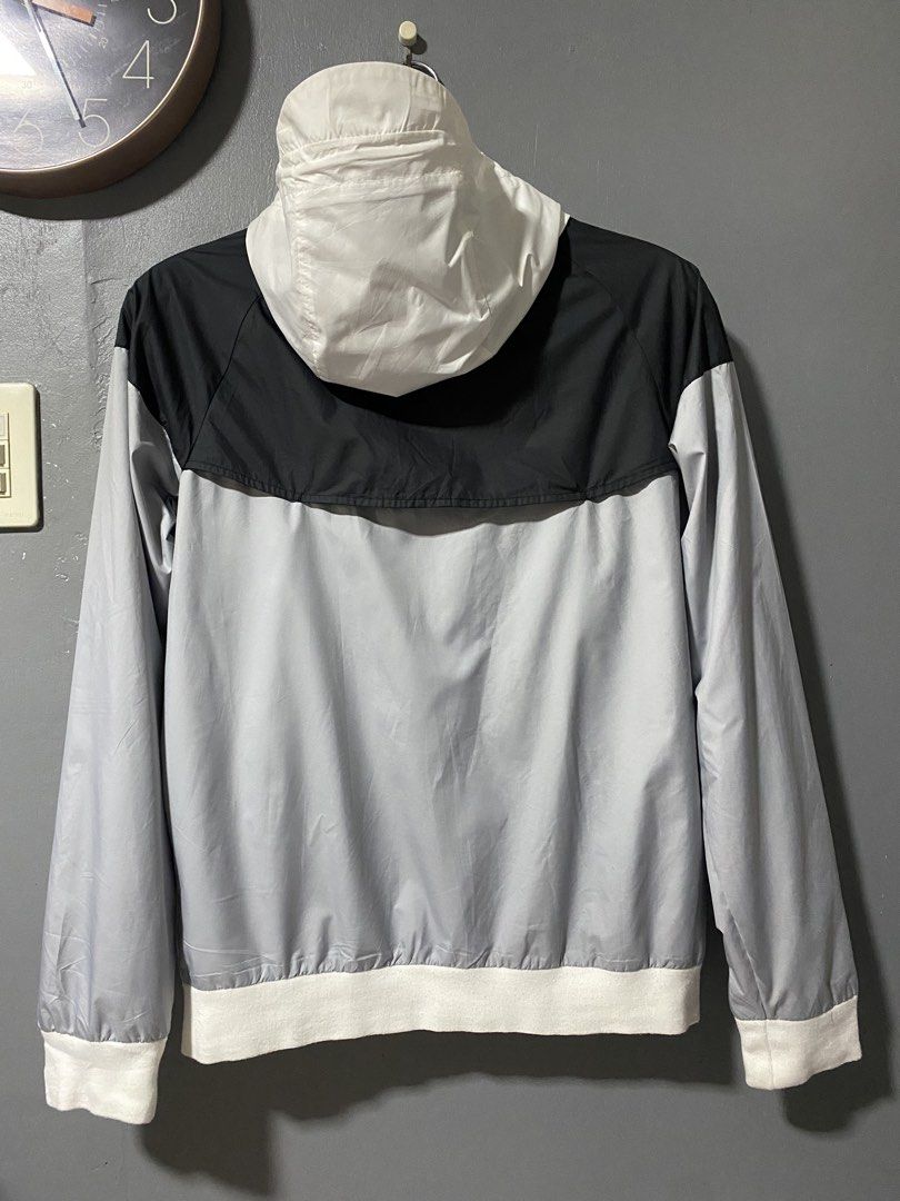 Nike Windrunner Jacket White Black Grey Size S (Category: Coats, Jackets and Outerwear) located in Tanay. Submitted by judevalcorza (Listing ID 1466040554, Image 2). Description: - Brand: Nike - Style: Windrunner jacket - Colorway: White, black, and grey - Size: S (Tag on collar) - Measurements: 26 inches length, 21 inches chest (pit-to-pit) - Material: 100% polyester with breathable mesh interior lining - Origin: Made in Vietnam - Features: Full