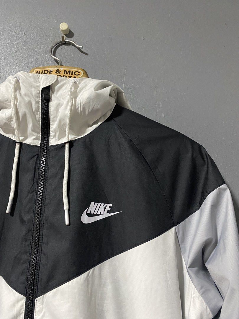 Nike Windrunner Jacket White Black Grey Size S (Category: Coats, Jackets and Outerwear) located in Tanay. Submitted by judevalcorza (Listing ID 1466040554, Image 3). Description: - Brand: Nike - Style: Windrunner jacket - Colorway: White, black, and grey - Size: S (Tag on collar) - Measurements: 26 inches length, 21 inches chest (pit-to-pit) - Material: 100% polyester with breathable mesh interior lining - Origin: Made in Vietnam - Features: Full