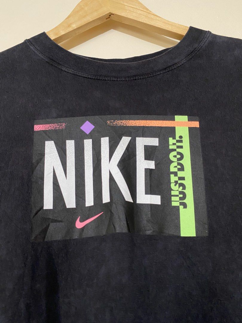 NIKE,washed short-sleeve T-shirt (Category: Shirts) located in Cavite. Submitted by jc_thrift95 (Listing ID 1466091602, Image 2). Description: - This is a Nike women’s washed short-sleeve T-shirt featuring a retro box logo with neon and geometric graphics. - Made in Turkey - L- 26 inch - W- 24 inch - (Unisex pwede) - Color rate 8/10 - See pictures details for dimes..