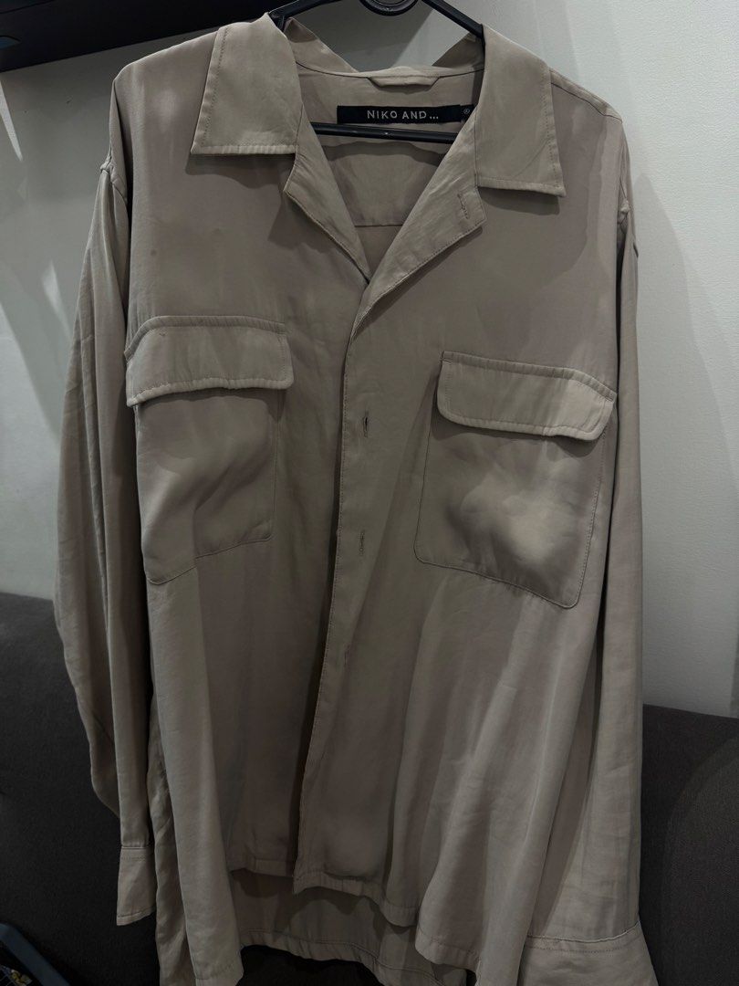 Niko and... Beige Rayon Button-Up Shirt (Category: Formal Shirts) located in Las Pinas. Submitted by sweetbelle (Listing ID 1466040730, Image 1). Description: - Brand: Niko and... - Color: Beige - Size: L - Material: 88% rayon, 12% polyester blend - Fit: Relaxed fit - Details: Long sleeves, front snap button closure, double chest pockets - Condition: Excellent, tags shown in photos.