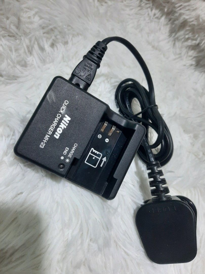 Nikon Quick Charger MH-23 for Camera Battery (Category: Batteries & Chargers) located in Manila. Submitted by villamante56249 (Listing ID 1465973979, Image 1). Description: - 100% Original Nikon MH-23 Quick Charger - Plugs directly into standard wall outlets (attached power cord) - Fast and efficient charging performance - Features clear LED charge status indicators - Sleek standard black finish - Compatible with select Nikon camera batteries - T